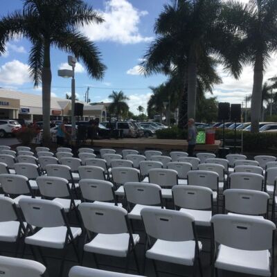 concert set up-chairs in santini plaza parking lot